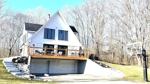 A two-story house with a covered front porch and a garage. - Life-Giving, Quiet retreat only 25 min west of Indpls. Peace, Pace, & Gratitude (Coatesville)