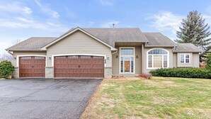A two-story house with a garage, a front porch, and a well-maintained lawn. - Wonderful home in prime Rosemount location.

 (Rosemount)