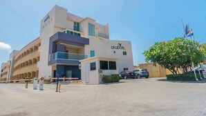 A modern building with a sign reading "aruba's" on the facade.