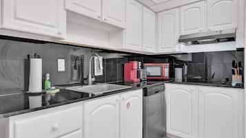 Comfort Condo | Private kitchen | Full-size fridge, microwave, oven, stovetop