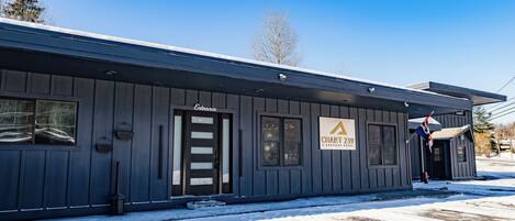 A building with a sign reading "Entrance" and "Chalet 239."