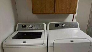 A laundry room with two Maytag front-loading washing machines. - Convenience in Kingsford

 (Kingsford)