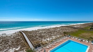 A beach resort with a swimming pool, a boardwalk, and a view of the ocean. - Relax in 409...Get in a Flip-Flop State of Mind (Navarre)
