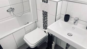 Hair dryer, towels, soap, toilet paper