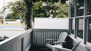 Relax on the covered porch with Adirondack chairs and enjoy the view of the surrounding area.