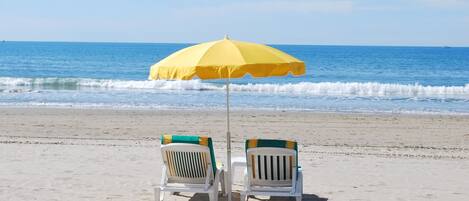 On the beach, sun-loungers, beach towels
