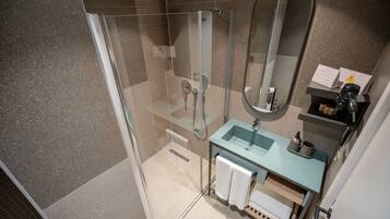 Economy Double Room | Bathroom | Shower, rainfall showerhead, hair dryer, slippers