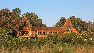 Romantic Tree House | Desk, laptop workspace, bed sheets