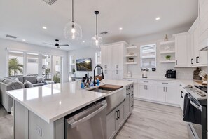 Fridge, microwave, oven, stovetop - Ocean Pearl on 18th—Luxury 4-Story Townhome w/ Heated Pool, Gulf-View Decks & Steps to Beach (Indian Rocks Beach)