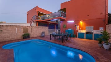 Outdoor pool, open 8:30 AM to 6:00 PM, pool umbrellas