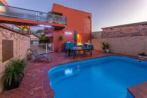 Outdoor pool, open 8:30 AM to 6:00 PM, pool umbrellas