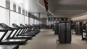 A modern gym with treadmills, weight machines, and a spacious layout. - Yutai hotel-Style Apartment (Shenzhen)