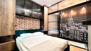 A modern bedroom with a brick accent wall, a large bed, and a cityscape mural. - AAA STAY PREMIUM Old Town Mariensztat (Warsaw)