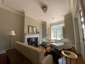 Smart TV, fireplace, books, printers