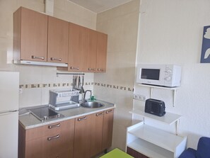 Fridge, microwave, toaster, cookware/dishes/utensils