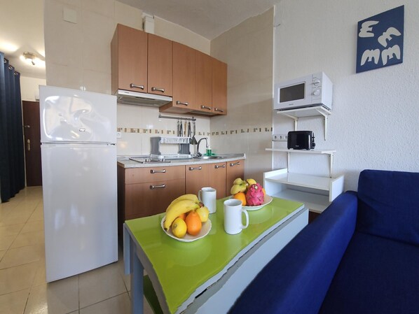 Fridge, microwave, toaster, cookware/dishes/utensils