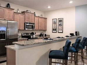 Fridge, microwave, oven, stovetop - Lovely Frozen Themed 4 BR townhome near Disney located in Paradise Palms Resort. (Kissimmee)