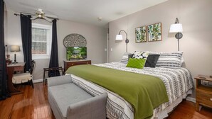 A bedroom with a bed, a chair, a desk, a lamp, and a ceiling fan. - On The Rocks! Spacious family-friendly 4BR home w/ bonus room (Basye)