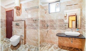 Deluxe-rum | Badrum | Dusch, regndusch, gratis toalettartiklar och handdukar