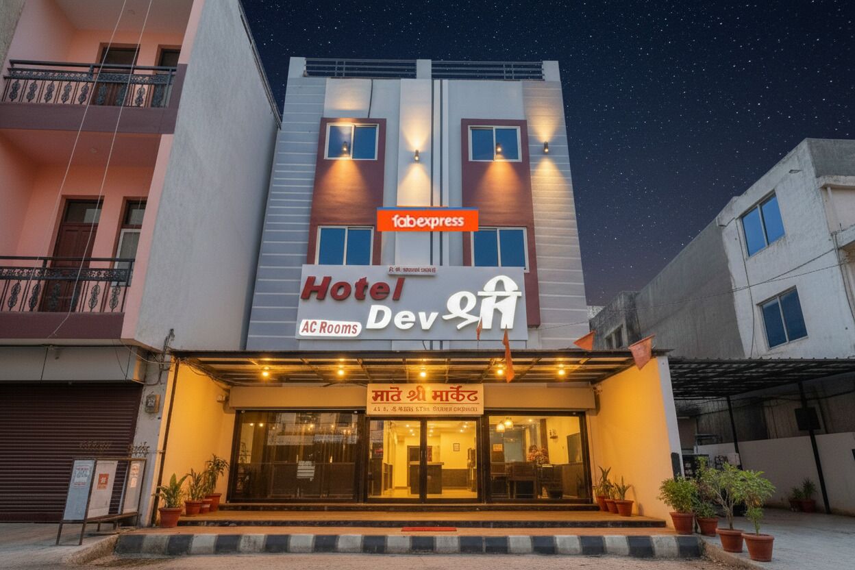 A hotel with a sign for 'Hotel Dev' and 'Fabexpress' on the facade.