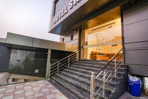 A hotel entrance with a staircase leading up to the lobby. - Fabhotel Prime Swarn Bhoomi (Kanpur)