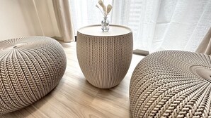 A room with a round woven ottoman, a matching woven side table, and a vase with dried flowers on the table. - 8Greige ] 2min Dotonbori Namba Kuromon Wi-Fi 〇 (Osaka)
