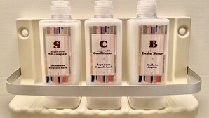 Three bottles of Japanese organic hair care products on a white shelf. - 8Greige ] 2min Dotonbori Namba Kuromon Wi-Fi 〇 (Osaka)