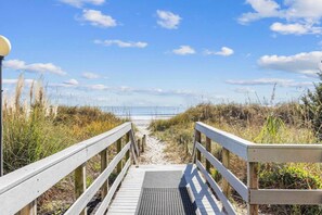 A wooden boardwalk leading to a beach with a clear sky. - Oceanfront Summit Bliss 3 BR w/ balcony (North Myrtle Beach)
