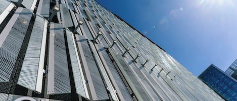 The Clarion Hotel Helsinki's exterior with a modern glass facade and a prominent sign.