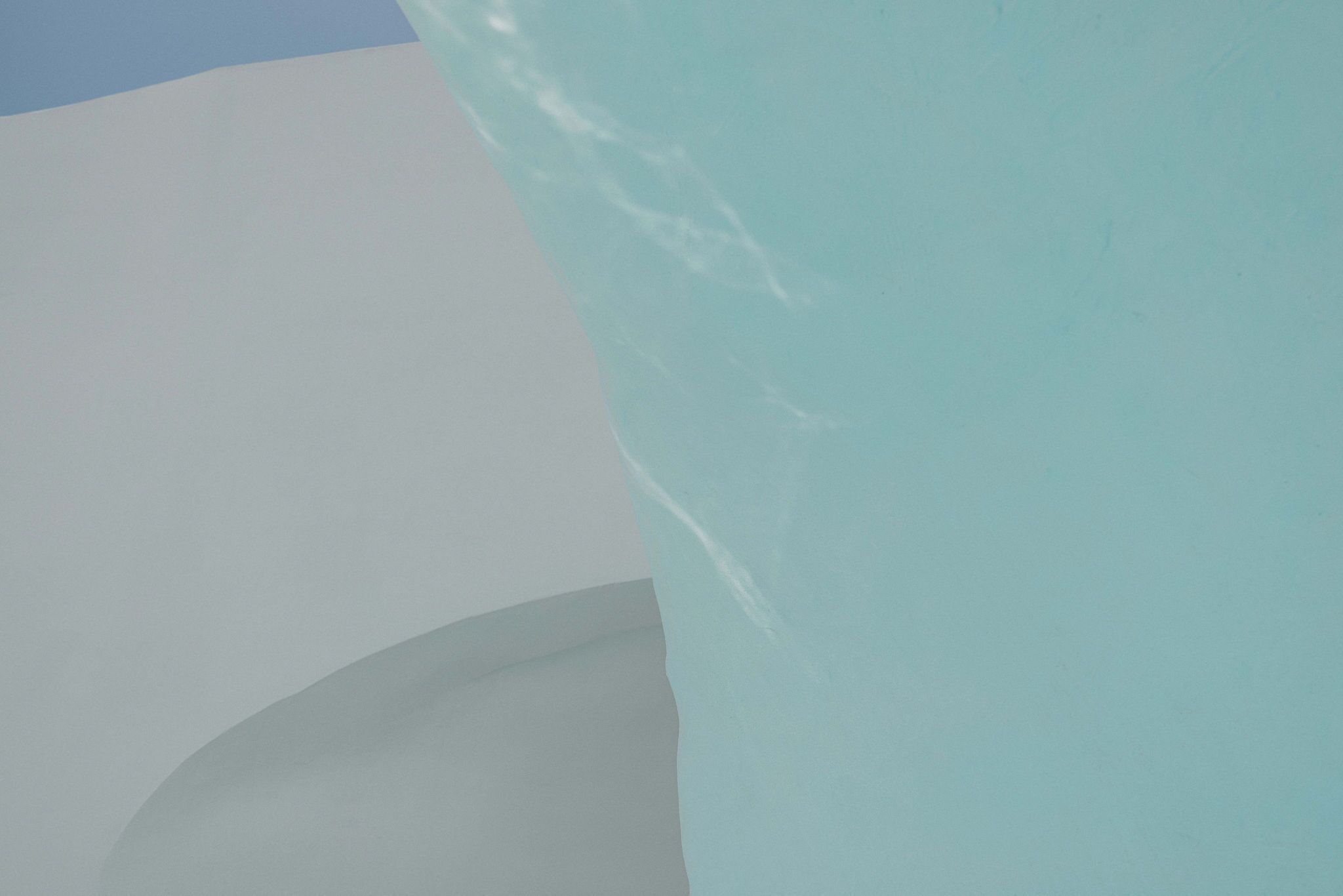 A close-up of a curved architectural feature with a smooth surface.