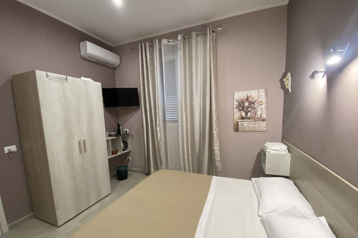 Departamento clásico | Camas con efecto memoria, wifi gratis y ropa de cama 