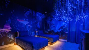 A bedroom with two beds, a nightstand, and a dresser. - Last Minute Disney! Private Pool, Hot Tub, Game Room & Themed Bedrooms. Book Now! #96895 (Orlando)
