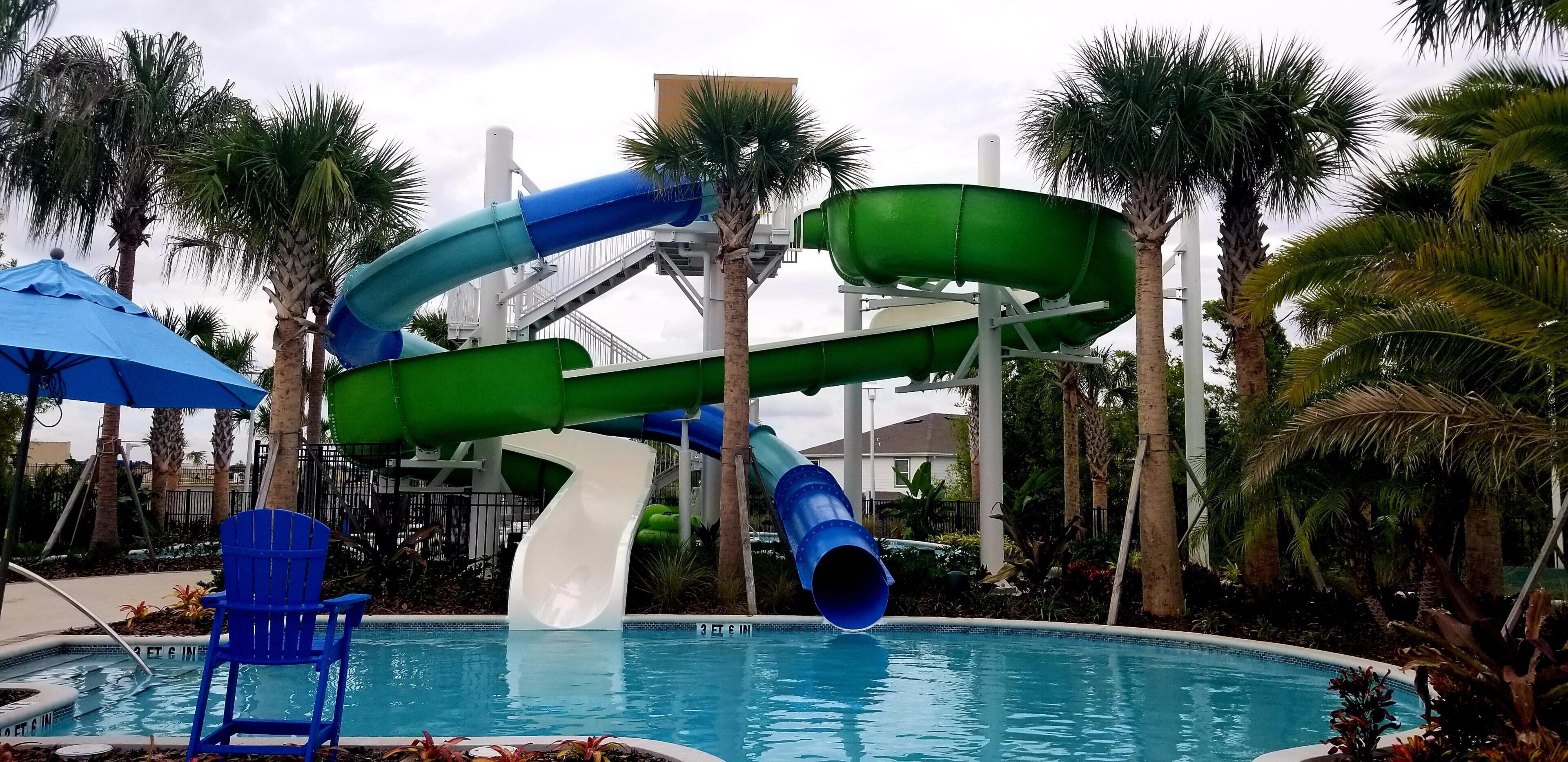 A water park with multiple slides and a pool area.