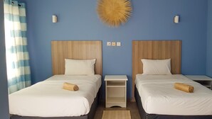 Basic Twin Room | Blackout drapes, iron/ironing board (on request), WiFi (free)
