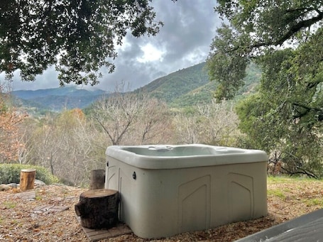 Outdoor spa tub. Relax to the Sound of the River while you soak in a Private Hot Tub