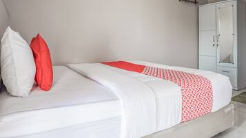 Desk, laptop workspace, bed sheets