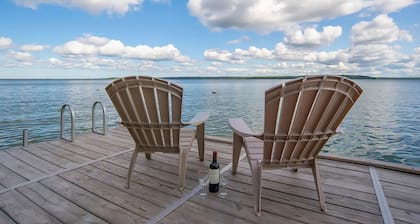 Charming lakefront cottage with large yard, dock, & fire pit - close to downtown