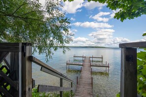 Property grounds - Charming lakefront cottage with large yard, dock, & fire pit - close to downtown (Topinabee)