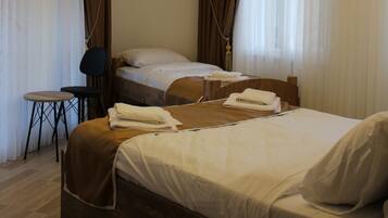 Family Double or Twin Room, Partial Sea View, Sea Facing | Desk, laptop workspace, soundproofing, WiFi (free)