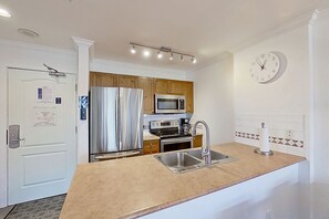 Fridge, microwave, oven, stovetop - Charming fourth-floor condo with balcony, walk to lifts & golf (Whistler)