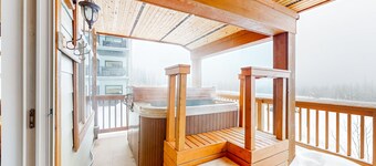 Amazing ski retreat with hot tub, fireplace, W/D & balcony views - walk to lifts