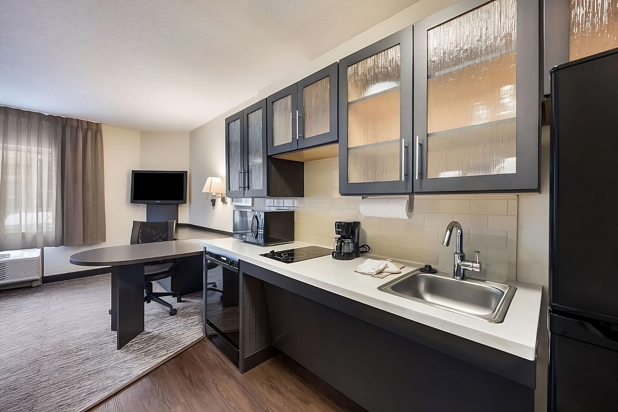 Brew morning coffee and prep snacks in the sleek kitchenette.