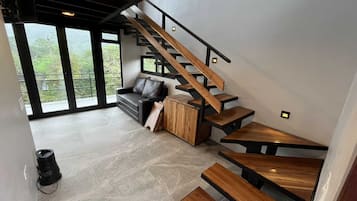 Design Villa | Living area | 32-inch Smart TV with cable channels, streaming services