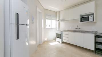 Junior Apartment | Private kitchen | Full-size fridge, microwave, cookware/dishes/utensils, cleaning supplies