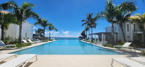 bohemian chic atmosphere with beach access and private swimming pool.