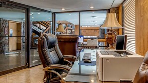 A modern office with leather chairs, a glass table, and a printer. - Westgate 8th Floor Remodeled Luxury Studio Suite- Ski-In/Out, Full Kitchen (Park City)