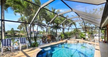 Sanctuary w/covered heated saltwater pool on canal
