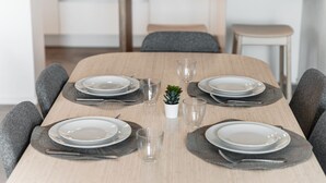 A dining table set with plates, glasses, and a small plant. - Friends & Family Retreat - My Home In Como (Como)