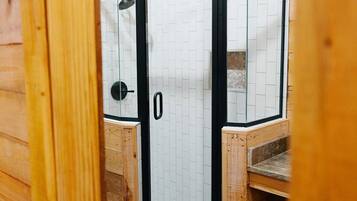 Shower, towels, soap, toilet paper