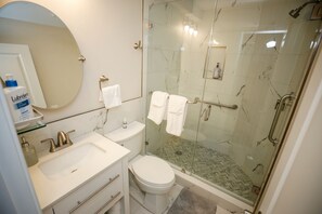 Shower, hair dryer, towels, soap